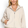 SaltTree Reflex beige fleece zip-up hoodie with drawstring hood and kangaroo pockets worn by a smiling model