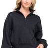 SaltTree model wearing a black Reflex fleece half-zip sweatshirt with a mock neckline and relaxed fit.