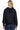 SaltTree Reflex black oversized fleece zip-up hoodie worn by a blonde model, back view with hood and banded hem