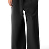 SaltTree Reflex black fleece sweatpants with an oversized relaxed leg, mid-rise drawstring waist, and raw hem detail.