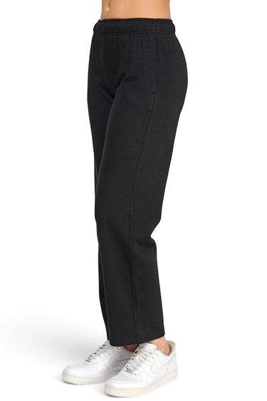 SaltTree Reflex black fleece straight leg sweatpants with elastic drawstring waist worn by a model in white sneakers