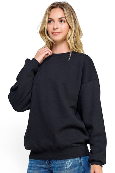 Model wearing a black SaltTree Reflex fleece oversized crew neck sweatshirt with ribbed trims and long sleeves.