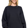 SaltTree Reflex black fleece crew neck sweatshirt with a relaxed oversized fit worn by a smiling model.