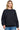 SaltTree Reflex black fleece crew neck sweatshirt with a relaxed oversized fit worn by a smiling model.