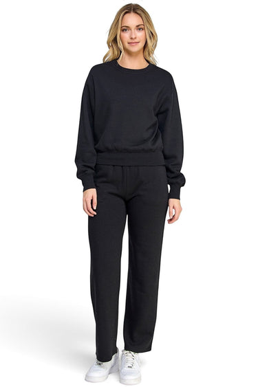 SaltTree model wearing a black Reflex fleece crewneck sweatshirt and matching relaxed fit sweatpants