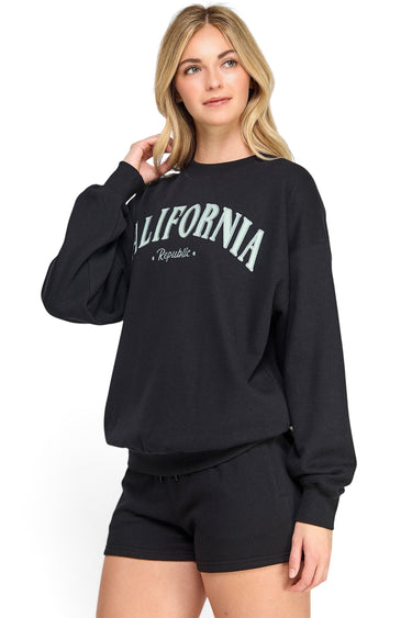SaltTree Reflex black oversized fleece sweatshirt with California embroidery worn by a model with blonde hair