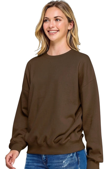 SaltTree Reflex brown fleece crew neck sweatshirt with a relaxed fit worn by a smiling model