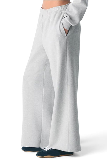 SaltTree Reflex ice grey fleece sweatpants with an oversized relaxed leg, mid-rise elastic waist, and raw hem detail.