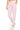 SaltTree Reflex pink French terry boyfriend joggers with a drawstring waist and banded cuffs worn by a model.