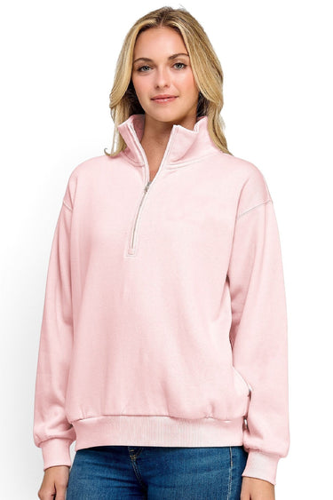 Model wearing a SaltTree Reflex pink fleece half-zip pullover with a mock neck collar and relaxed fit