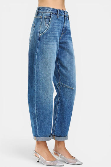 SaltTree Risen Jeans medium wash slouchy barrel jeans with a high rise and cuffed hem worn by a model.