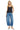 SaltTree model wearing Risen Jeans medium wash high-rise slouchy barrel jeans with a cuffed hem and black lace top.