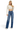 SaltTree Risen Jeans high-rise wide baggy denim with tummy control in medium wash, worn by a model with a crop top.