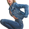 SaltTree Wax Jean medium blue cropped destructed denim trucker jacket worn by a model in a crouching pose