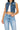SaltTree Wax Jean cropped boxy medium blue denim vest with destroyed detailing and button-front closure on a model.