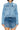 SaltTree Wax Jean medium blue destructed denim trucker jacket with button front and chest pockets on a model