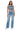 SaltTree model wearing Wax Jean medium blue low-rise fitted wide leg jeans with a 31-inch inseam and comfort stretch.