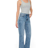 SaltTree model wearing Wax Jean mid-rise wide-leg jeans in a medium blue snow wash denim with a classic 5-pocket design