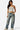 SaltTree model wearing a white Love Poem double-layered strapless tube top with blue jeans and sneakers.