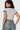 SaltTree Love Poem white cropped polo top with black contrast collar and sleeve cuffs worn by a model
