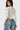 Model wearing a white SaltTree Love Poem long sleeve scoop neck bodysuit with a supportive second-skin fit