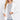 SaltTree white open front cardigan with rib banded trim, long sleeves, and front pockets worn by a blonde model.