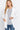 SaltTree white open front cardigan with rib banded trim, long sleeves, and front pockets worn by a blonde model.