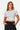 SaltTree Love Poem white seamless crew-neck crop top with cap sleeves worn by a model